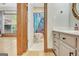 Bathroom view featuring a white vanity with a white countertop and a door to the toilet and shower at 165 Hideaway Dr, Fayetteville, GA 30215