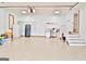 Spacious garage with storage cabinets, stairs to an upper level, and lots of open space at 165 Hideaway Dr, Fayetteville, GA 30215