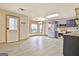 Open kitchen with stainless appliances, dining area, and white door to the outside at 165 Hideaway Dr, Fayetteville, GA 30215