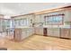 Open kitchen and dining area with hardwood floors, modern appliances, and bar seating at 165 Hideaway Dr, Fayetteville, GA 30215