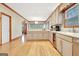 Spacious kitchen featuring recessed lighting, wood floors, and stainless steel appliances at 165 Hideaway Dr, Fayetteville, GA 30215