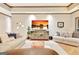 Spacious living area featuring hardwood floors and a cozy seating arrangement at 165 Hideaway Dr, Fayetteville, GA 30215