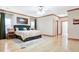 Main bedroom with wood trim, ceiling fan, and a large bed with end tables at 165 Hideaway Dr, Fayetteville, GA 30215