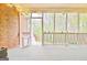 Spacious screened porch featuring brick accents and an open view at 165 Hideaway Dr, Fayetteville, GA 30215