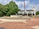 Outdoor fountain located in a Fayetteville community with brick pavers and views of city buildings at 165 Hideaway Dr, Fayetteville, GA 30215