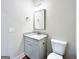 Bathroom featuring a granite countertop vanity and standard toilet at 217 Point Ridge Ct, Temple, GA 30179