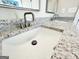 Close up on bathroom sink and counter with granite countertop at 217 Point Ridge Ct, Temple, GA 30179