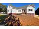 Beautiful two-story home with white siding, lovely landscaping, and a charming covered front porch at 217 Point Ridge Ct, Temple, GA 30179