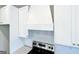 Close up of kitchen featuring a stainless steel oven with a white range hood and subway tile backsplash at 217 Point Ridge Ct, Temple, GA 30179