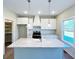 Close up of kitchen island with granite countertops, farm style sink, and stainless steel appliances at 217 Point Ridge Ct, Temple, GA 30179
