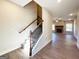 Living room with hardwood floors, staircase and a fireplace at 217 Point Ridge Ct, Temple, GA 30179