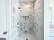 Beautiful, tiled shower with marble accents and a built-in niche for storage at 217 Point Ridge Ct, Temple, GA 30179