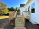 Wood deck with railing and stairs provides a great transition from the backyard to the home at 217 Point Ridge Ct, Temple, GA 30179