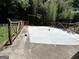Basketball court bordered by a rustic fence and bamboo at 4389 & 4381 Campbell Rd, Snellville, GA 30039
