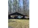 View of the large carport with a camper, providing ample space for vehicle storage and outdoor activities at 4389 & 4381 Campbell Rd, Snellville, GA 30039