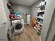 Laundry room with washing machine, shelving, and water heater at 4389 & 4381 Campbell Rd, Snellville, GA 30039