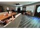 View of the open concept living room with fireplace and modern flooring at 4389 & 4381 Campbell Rd, Snellville, GA 30039