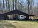 Pole barn with camper, storage and ATV on a grass lot at 4389 & 4381 Campbell Rd, Snellville, GA 30039