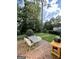 Spacious backyard featuring a brick patio with outdoor dining set and a built-in grill perfect for entertaining at 497 Pine Haven Ln, Atlanta, GA 30342