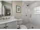 Contemporary bathroom featuring white subway tile and a glass-enclosed shower at 497 Pine Haven Ln, Atlanta, GA 30342