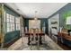 Dining room features hardwood floors, large windows, and decorative accents for an inviting atmosphere at 497 Pine Haven Ln, Atlanta, GA 30342