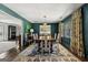 Dining room showcasing hardwood floors, elegant lighting, and an open layout that connects to other living spaces at 497 Pine Haven Ln, Atlanta, GA 30342