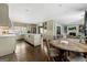 Spacious open-concept kitchen with stainless appliances, island seating, and an adjacent breakfast nook at 497 Pine Haven Ln, Atlanta, GA 30342