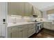 Gourmet kitchen boasting stainless steel appliances, white countertops, and classic subway tile backsplash at 497 Pine Haven Ln, Atlanta, GA 30342