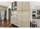 This kitchen features bright cabinets, stainless steel appliances and an open design to other living areas at 497 Pine Haven Ln, Atlanta, GA 30342