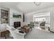 Comfortable living room featuring a fireplace, built-in bookcases and warm natural light at 497 Pine Haven Ln, Atlanta, GA 30342
