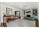 Inviting living room with fireplace, built-in shelves and an opening to the dining area at 497 Pine Haven Ln, Atlanta, GA 30342