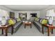 Open-concept living room featuring matching sofas with accent pillows and decorative tables at 497 Pine Haven Ln, Atlanta, GA 30342