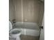 Bathroom with tub and toilet at 6540 Lower Dixie Lake Rd, Union City, GA 30291