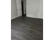 Bedroom featuring modern wood-look flooring and neutral paint, along with ample closet space at 6540 Lower Dixie Lake Rd, Union City, GA 30291