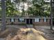 Charming brick multifamily home featuring a sidewalk leading to the front doors and green shutters, surrounded by trees at 6540 Lower Dixie Lake Rd, Union City, GA 30291
