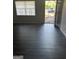 A bright living room with hard wood floors and a window with a view at 6540 Lower Dixie Lake Rd, Union City, GA 30291
