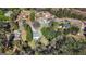 An aerial view showcases the property's location within a quiet neighborhood surrounded by mature trees at 115 Brook Hollow Dr, Mcdonough, GA 30252