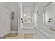 Bright bathroom features large bathtub with jets, shower and white vanity at 115 Brook Hollow Dr, Mcdonough, GA 30252