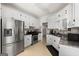 Traditional kitchen features granite countertops, stainless steel appliances and ample storage at 115 Brook Hollow Dr, Mcdonough, GA 30252