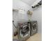 Laundry room equipped with washer and dryer, storage shelves and bright natural light at 115 Brook Hollow Dr, Mcdonough, GA 30252