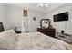 Bright bedroom features large bed, dresser and access to attached bathroom at 115 Brook Hollow Dr, Mcdonough, GA 30252