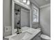 The bathroom features a modern vanity, stylish fixtures, and a glass shower at 5155 Rosestone Nw Dr, Lilburn, GA 30047