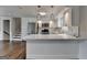 Modern kitchen featuring white cabinets, marble counters, and stainless steel appliances at 5155 Rosestone Nw Dr, Lilburn, GA 30047