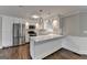 Bright kitchen with white cabinets, marble countertops, and stainless steel appliances at 5155 Rosestone Nw Dr, Lilburn, GA 30047