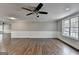 Spacious living room with decorative chair rail, hardwood floors, and neutral paint at 5155 Rosestone Nw Dr, Lilburn, GA 30047