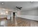 Spacious open concept living room and kitchen with white cabinets and hardwood floors at 5155 Rosestone Nw Dr, Lilburn, GA 30047