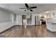Open floor plan with hardwood floors, white trim, stainless appliances and staircase leading to the second floor at 5155 Rosestone Nw Dr, Lilburn, GA 30047