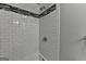 Modern bathroom showcasing a tiled shower with a sleek design, complemented by stylish fixtures at 5155 Rosestone Nw Dr, Lilburn, GA 30047