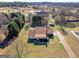 Aerial view of house with extended lawn, long driveway, and quiet neighborhood at 105 Overlook Dr, Mcdonough, GA 30252