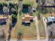 Expansive aerial view of a well-maintained home with a long driveway and mature landscaping at 105 Overlook Dr, Mcdonough, GA 30252